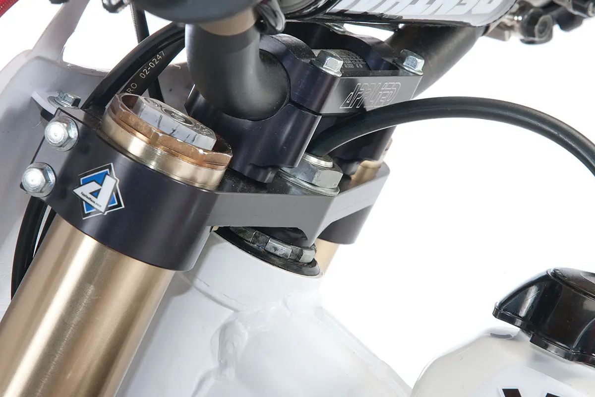 Applied Racing made us custom triple clamps that mated with the new-school Showa forks and Cycra front fender.